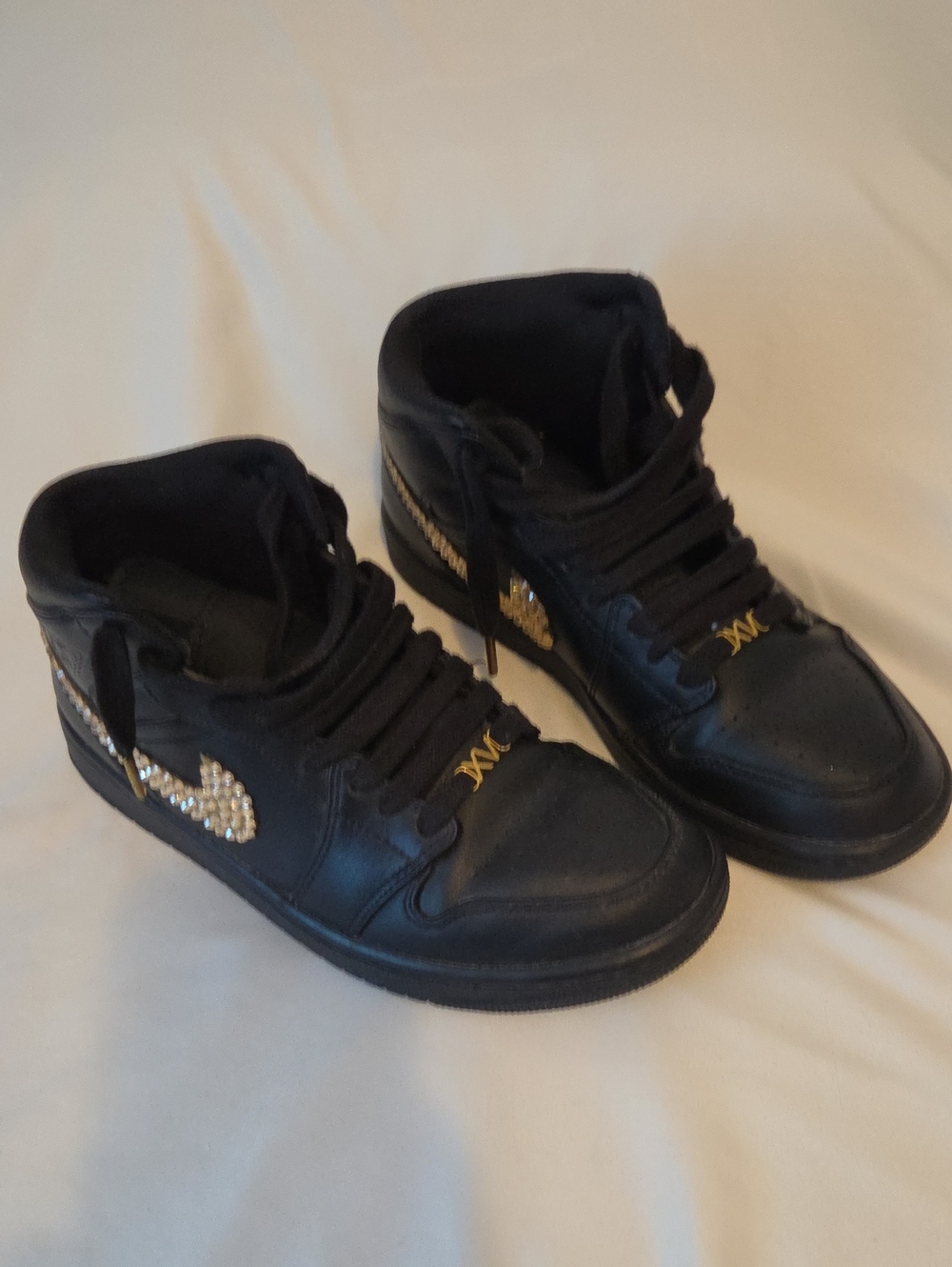 Black High-Top Sneakers with Gold Jumpman Logo